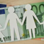 Paper family cut-out on euro banknotes – Family budget concept